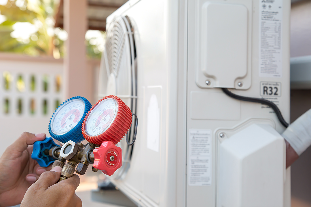 air-repair-mechanic-using-measuring-pressure-gauge-equipment-filling-home-air-conditioner-after-cleaners