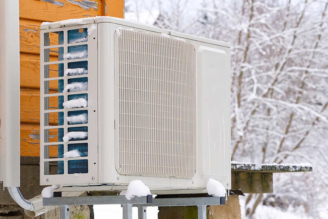 air-water-heat-pump-near-old-wooden-house-winter Why Ductless Systems Excel