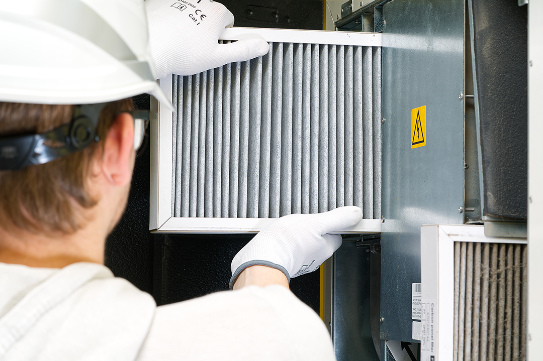 hvac-filter-replacement-home-central-air-system-servicemen-changing-filter-furnace indoor air quality air filter being replaced