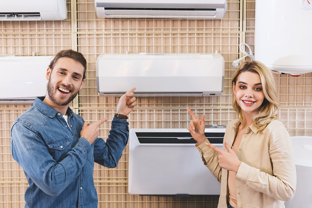 smiling-boyfriend-and-girlfriend-pointing-with-fin-2024-11-19-09-51-35-utc Ready to Explore Ductless Options for Your Home?
