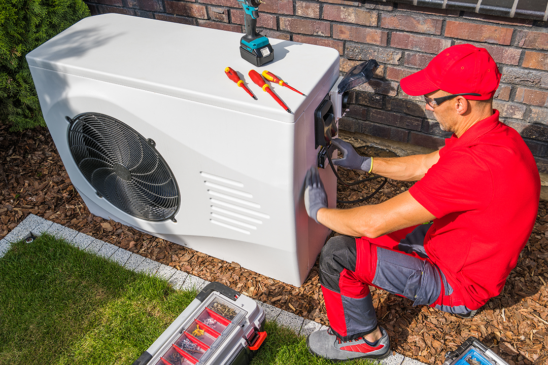 technician-repairing-heat-pump-unit-2025-03-13-13-36-27-utc Ductless Heat Pump Installation